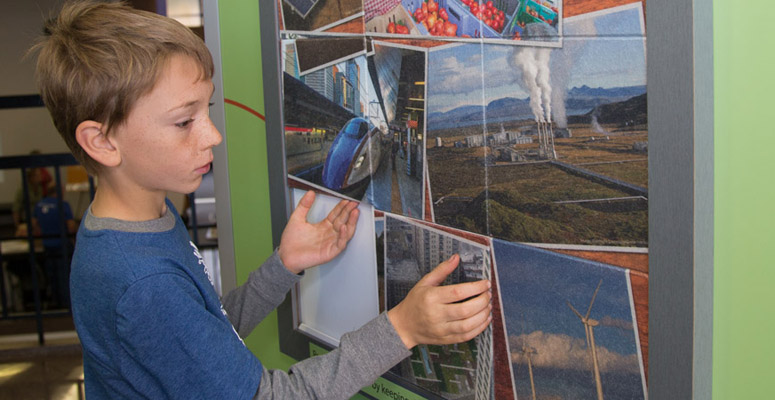A child looks at an exhibit at the NCAR Mesa Lab in Boulder