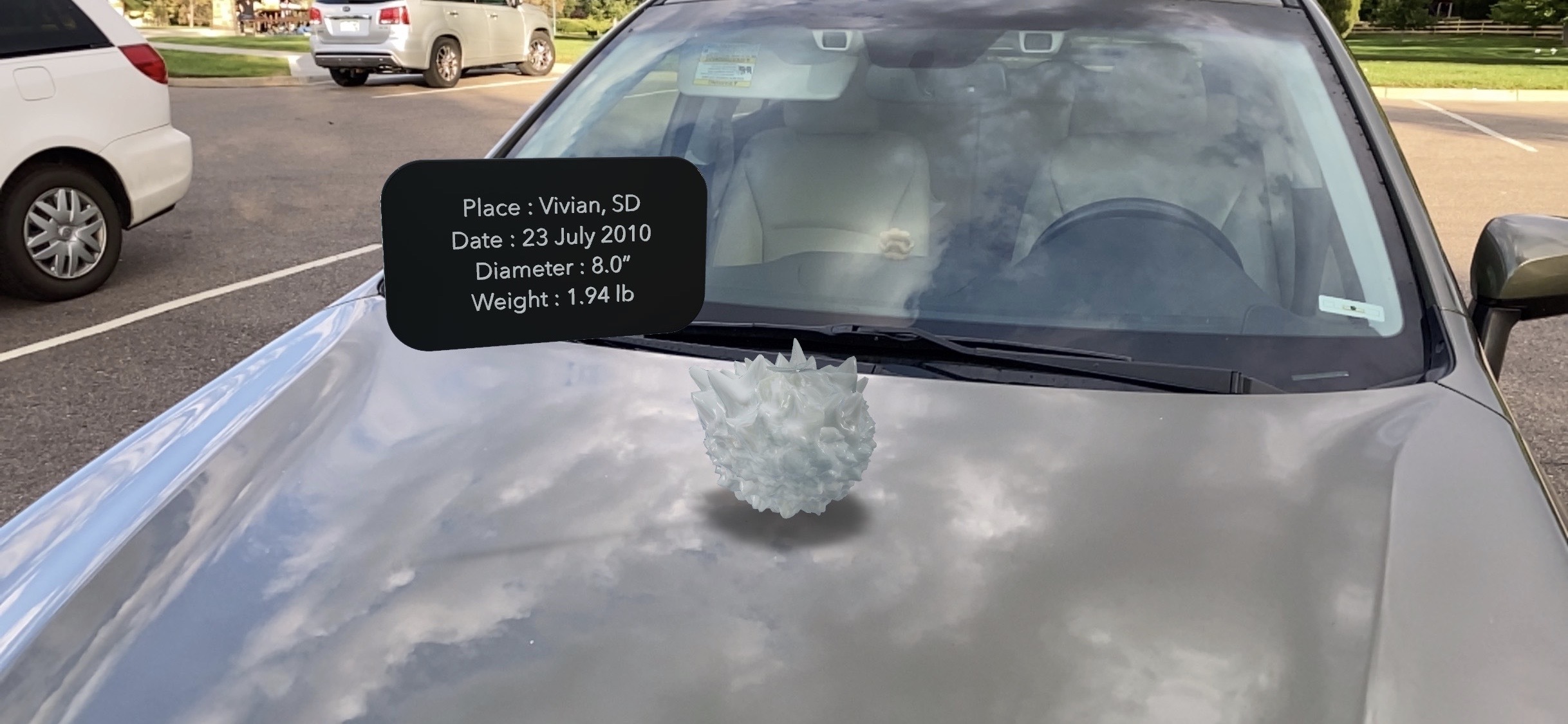 An AR model of a hailstone sitting on top of a cloud