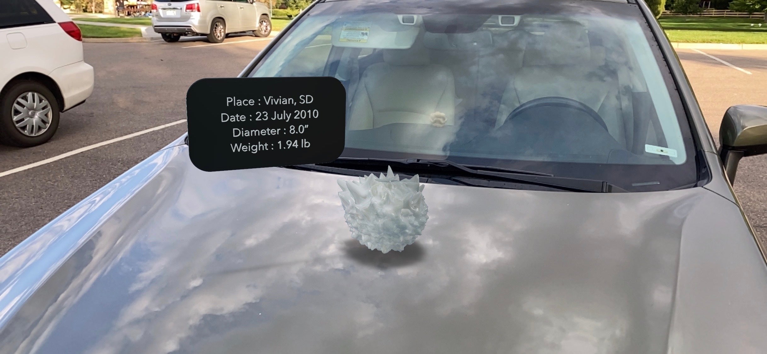 An AR model of a hailstone sitting on top of a cloud