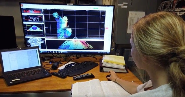 REU student working on a computer