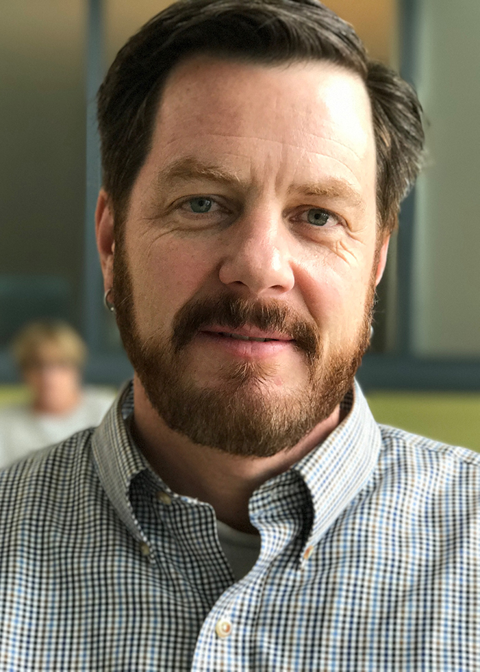 Headshot of NCAR scientist Michael Mills