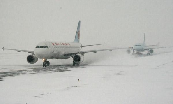 Airplanes on a snowy runway