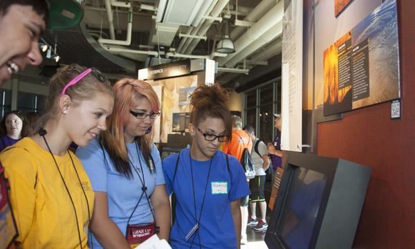 Students look at an NWSC exhibit