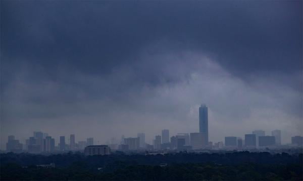 A storm forms over the skyline of Houston